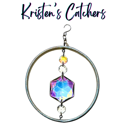 Iridescent hexagon sun catcher with holographic silver frame and purple-blue crystal