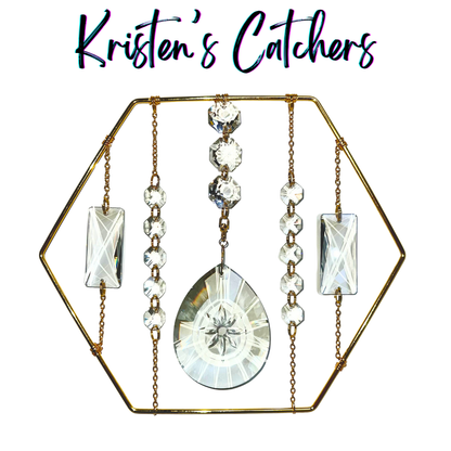 Modern hexagonal tabletop sun catcher with rotating crystal centerpiece and golden frame