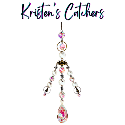 Whimsical mushroom bronze sun catcher with pink mushroom charm, pink A/B crystals, flower connectors and three-strand cascade with teardrop prism