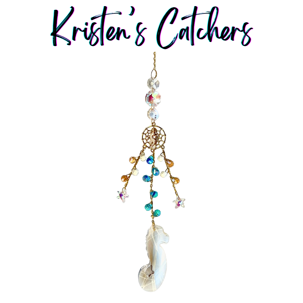 Handcrafted sun catcher with large iridescent seahorse prism pendant, gold woven net connector with seahorse charm, cascading teal amber and iridescent micro crystal fringe, A/B star charms, and large shifting iridescent header beads