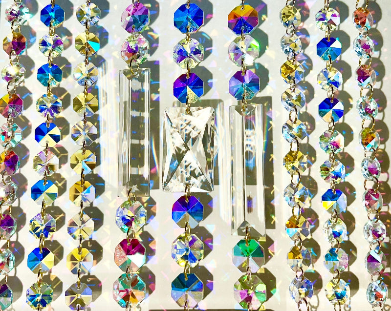 Multicolored crystal earrings on a white background