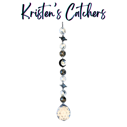 Handmade midnight galaxy crystal sun catcher with deep navy and black beads, star charms, and iridescent pendant Las Vegas