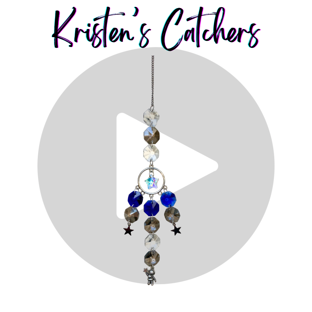 Reach for The Stars sun catcher with blue and silver crystals, star-shaped and astronaut charms