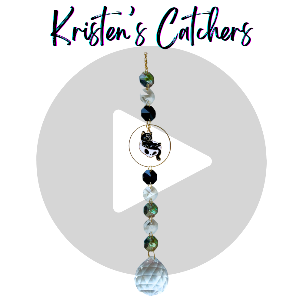 Black kitty in a skull cap with clear white globe crystal suncatcher