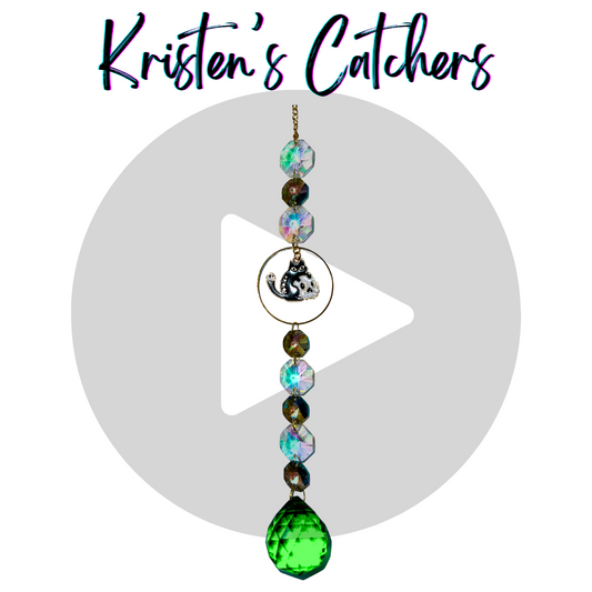 black kitty and a skull single strand sun catcher