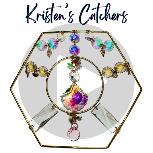 pink and purple shell crystal in a golden hexagon frame tabletop top sun catcher with sea motif and golden charms