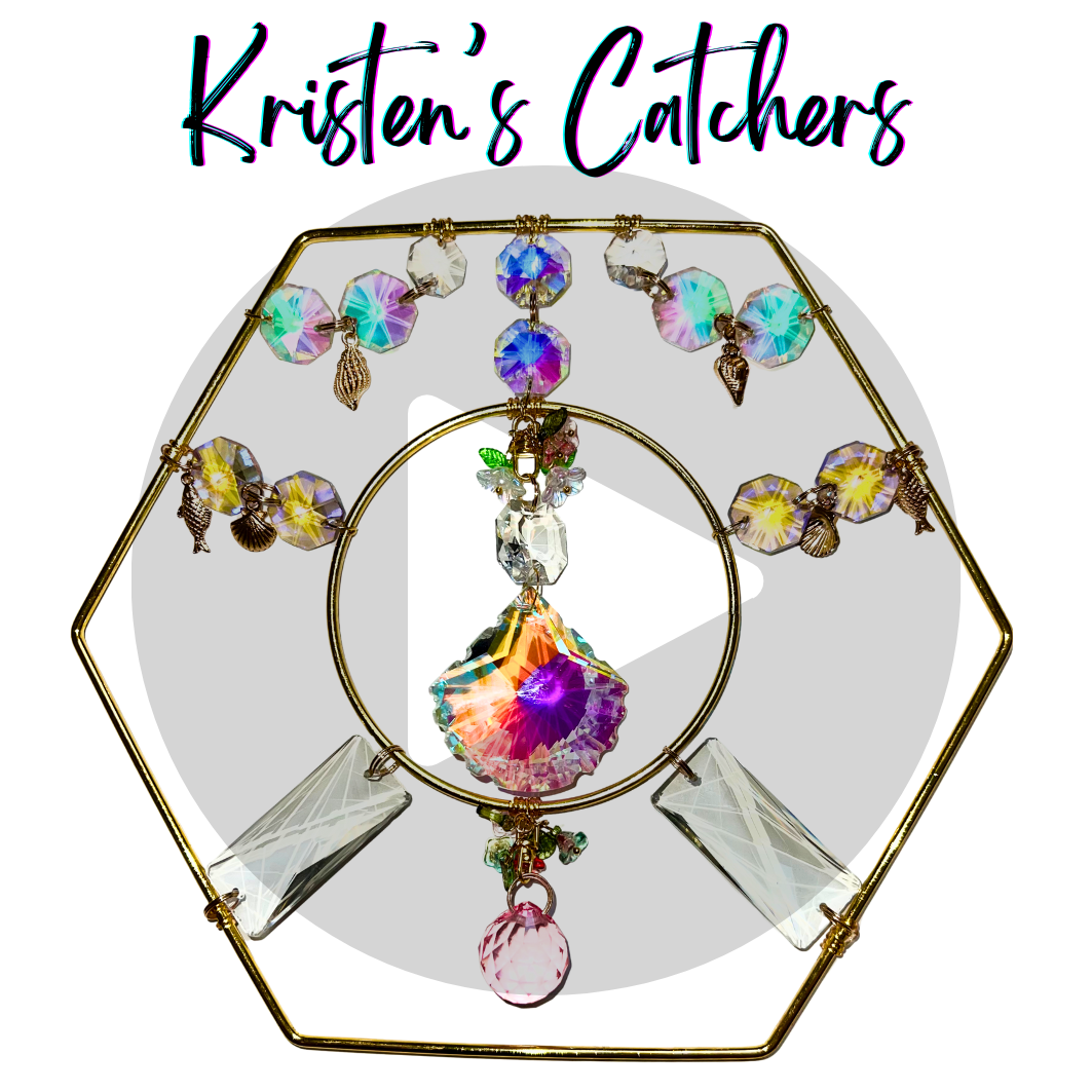 pink and purple shell crystal in a golden hexagon frame tabletop top sun catcher with sea motif and golden charms