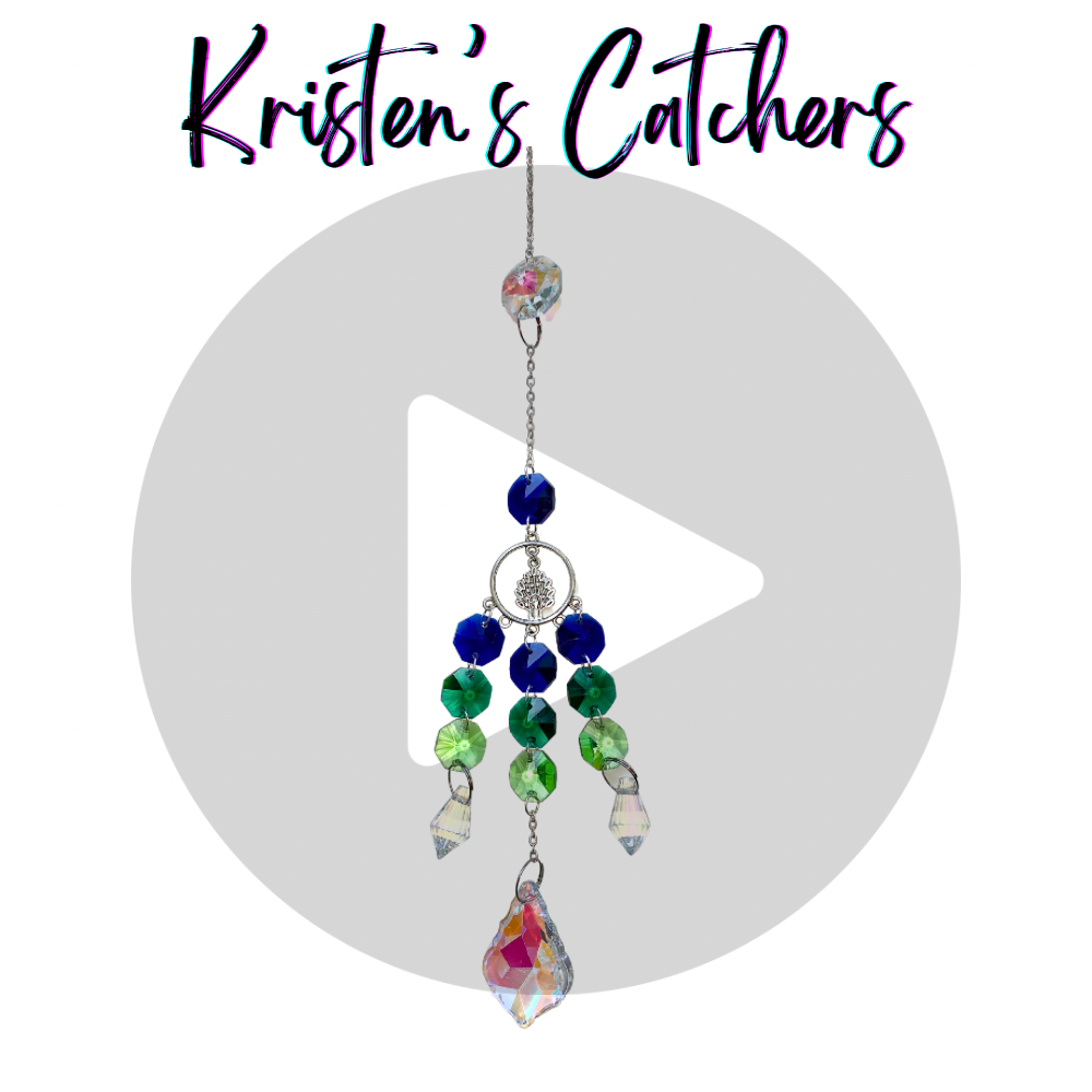 Tivoli the Peacock sun catcher with green and blue crystals, silver peacock charm in a geometric frame