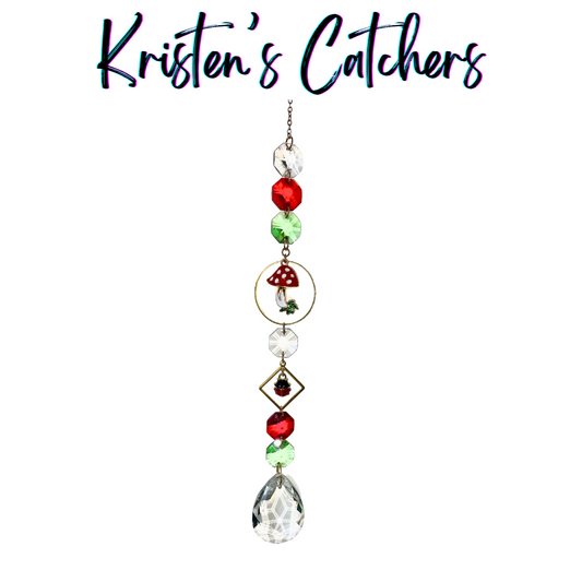 Mushroom Magic sun catcher with red, green, and clear crystals, toadstool and ladybug charms