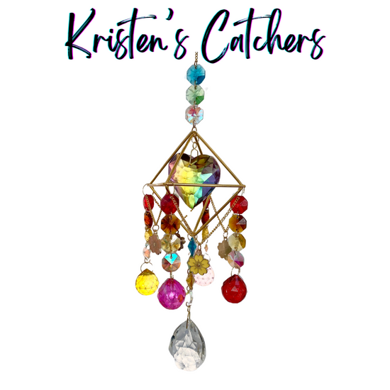 Flower Child sun catcher with colorful crystals, flower charms and a gold geometric frame